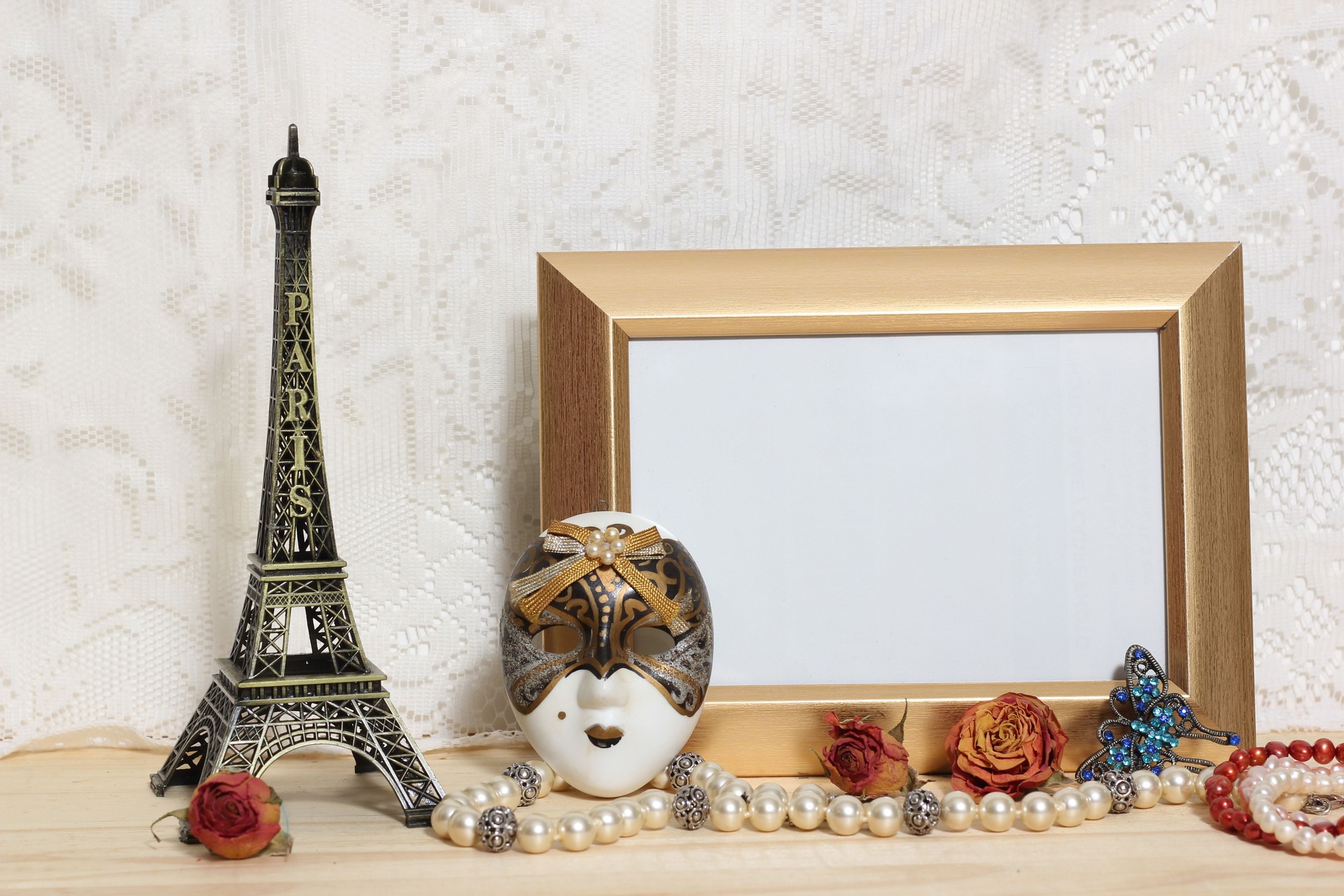 Photo frame with Eiffel tower and carnival mask on lace background
